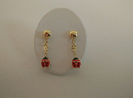 Gouden kinderoorringen slinger lieveheerbeestje